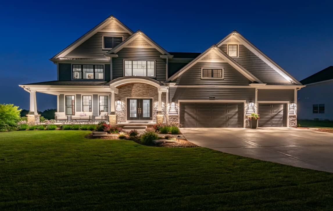 Home with outdoor lighting installed
